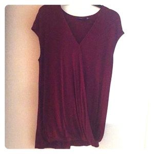 Maroon V-neck open, draped top.